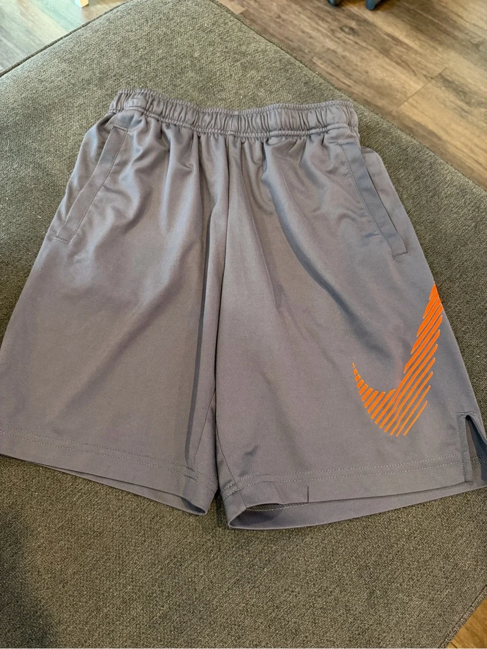 Nike Athletic Gray Shorts with Orange Swoosh Detail